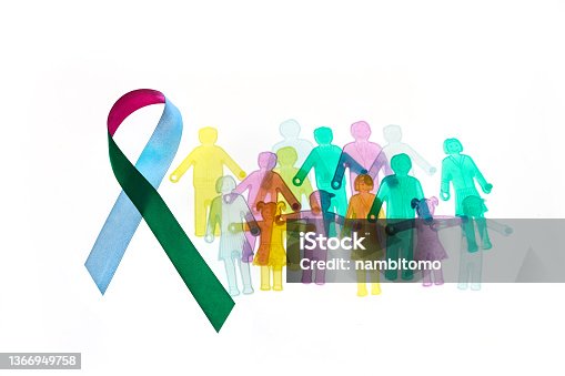 istock Rare Disease Day Background. Colorful awareness ribbon with group of people with rare diseases. 1366949758