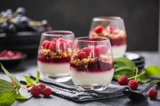 Raspberry Panna cotta or 
parfait with raspberry jelly, Italian dessert, homemade cuisine. Copy space. stock photo