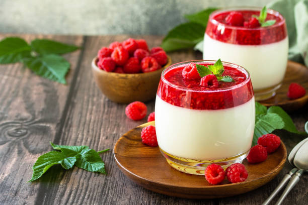 Raspberry Panna cotta with raspberry jelly, Italian dessert, homemade cuisine. Copy space. stock photo