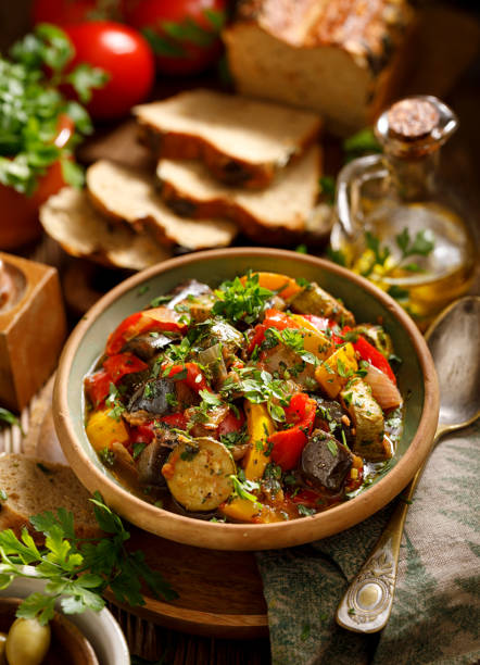 Ratatouille, Vegetarian stew made of zucchini, eggplants, peppers, onions, garlic and tomatoes with addition of aromatic herbs. stock photo
