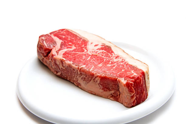 Raw dry aged steak stock photo