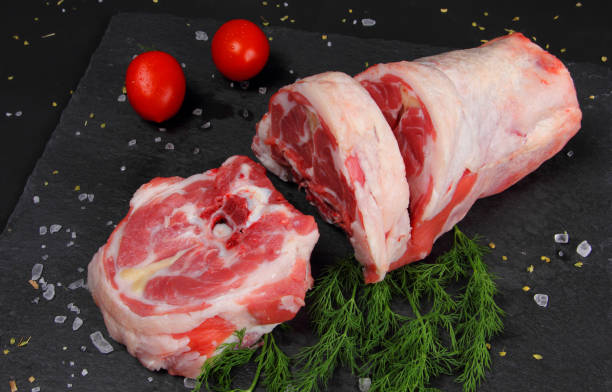 Raw Neck Meat on the Black Table stock photo