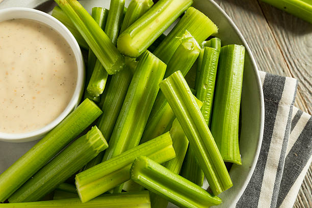 raw-organic-green-celery-stalks-picture-id613032260