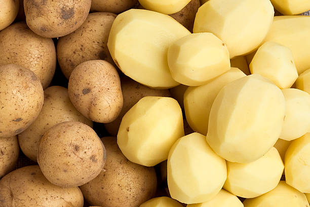 Raw Potatoes Raw Potatoes peeled stock pictures, royalty-free photos & images