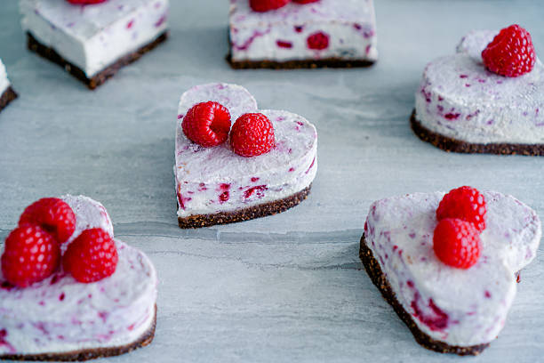 Raw vegan raspberry coconut cheesecake stock photo