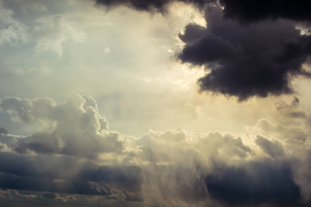 rays of Sun through the clouds stock photo