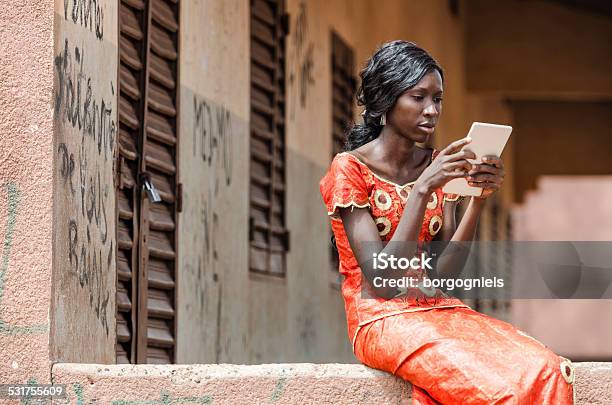 Reading Symbol: African Black Ethnicity Woman Reading On Tablet Computer