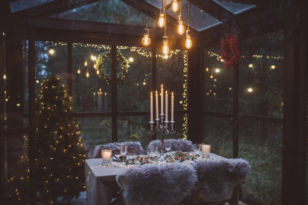 Ready for Christmas dinner Table at cottage green house decorated for Christmas dinner. greenhouse table stock pictures, royalty-free photos & images