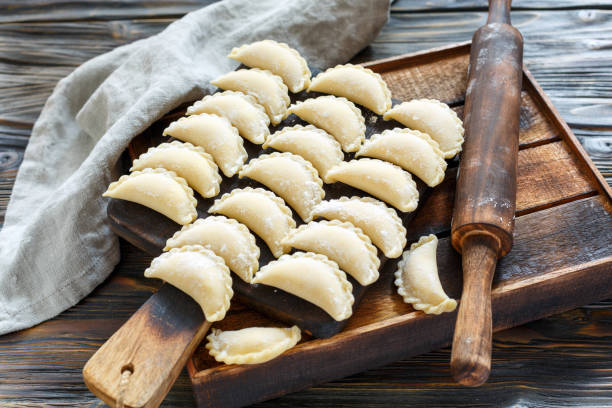 Ready for cooking dumplings with cottage cheese. stock photo