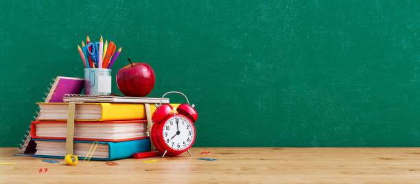 ready for school concept background with books, alarm clock and accessory - back to school imagens e fotografias de stock