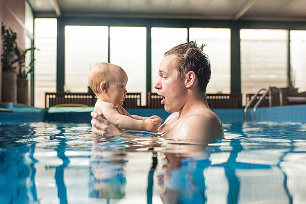 ready, set...go! - swimming baby stockfoto's en -beelden