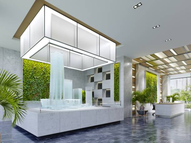 Real estate sales office with large glass building mock-up illuminated from above in modern interior. stock photo