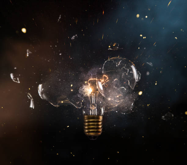 Real explosion of vintage electric bulb. real explosion of vintage electric bulb, close-up.real explosion of vintage electric bulb, close-up. slow motion stock pictures, royalty-free photos & images