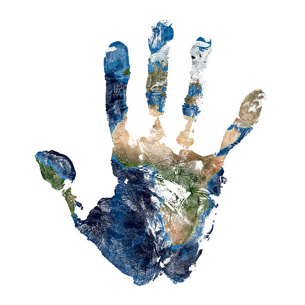 Real hand print with a map of our planet Earth stock photo