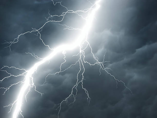 real lightning on stormy sky stock photo