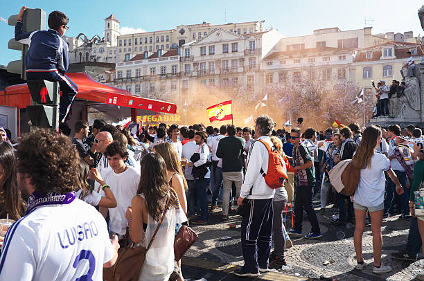 Real Madrid Fans in Lisbon Lisbon, Portugal - May 24, 2014: Real Madrid fans celebrate in the Rossio Square in Lisbon downtown, antecipating the UEFA Europa League final. real madrid stock pictures, royalty-free photos & images