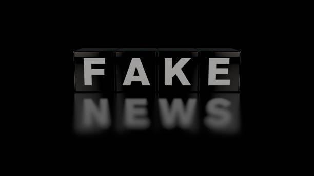 Realistic 3D Dice Fake News Concept on Shiny Black Background with Reflection of Words stock photo
