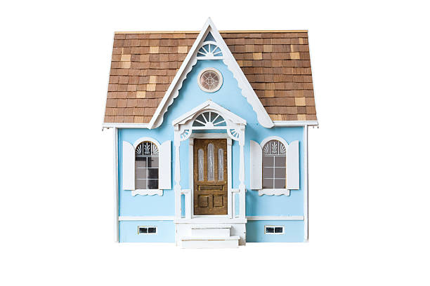 Realistic looking wooden dollhouse isolated on white with clipping path Realistic looking wooden dollhouse isolated on white with clipping path model house stock pictures, royalty-free photos & images