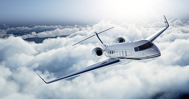 Realistic photo of White Luxury generic design private jet flying stock photo