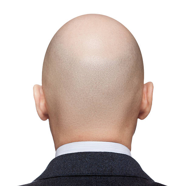 A rear view of a mans bald head stock photo