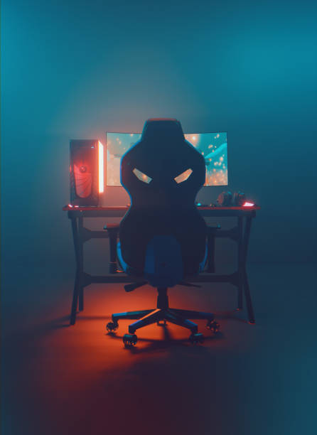 Rear view of a neon lit gaming setup with desktop pc and a big monitor stock photo