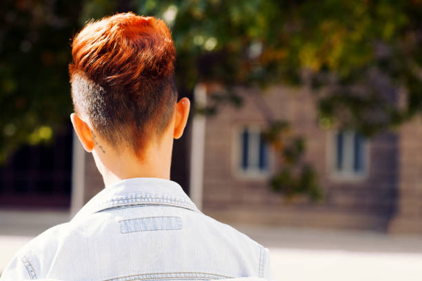 Rear view of a redhead woman stock photo