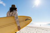istock Rear view of Aussie woman checking the surf 1335409800