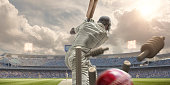 istock Rear View Of Cricket Ball Hitting Stumps Behind Batsman 520834490