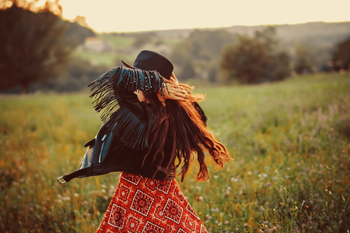 Rear View Of Happy Young Woman Dancing In The Field Stock Photo ...