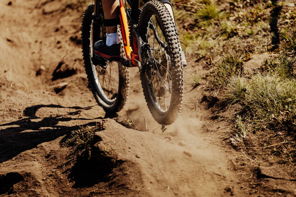 rear wheel sport bike rides on earth dust stock photo