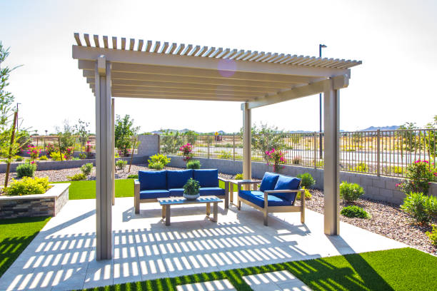 Rear Yard Pergola Covering Patio Furniture Back Yard Pergola Covering Blue Cushion Patio Furniture patio stock pictures, royalty-free photos & images