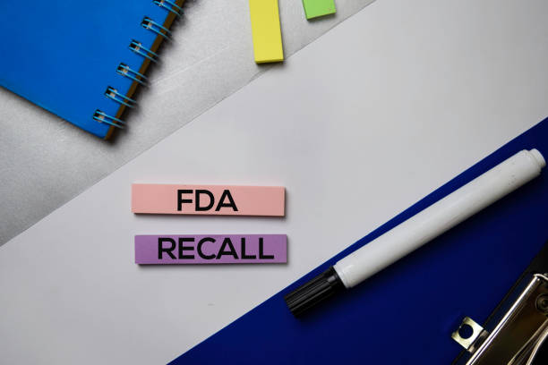 FDA Recall text on sticky notes with color office desk concept stock photo