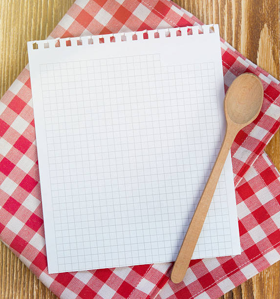 Recipe clean paper page for notes. Recipe white page on picnic cloth on wooden background.Paper with copyspace for kitchen notes.Clean blank. recipe stock pictures, royalty-free photos & images