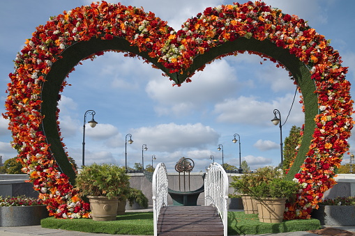 Moscow, Russia - September 29, 2021: Luzhkov (Tretyakov) Bridge. Reconciliation bench for newlyweds and a heart of flowers