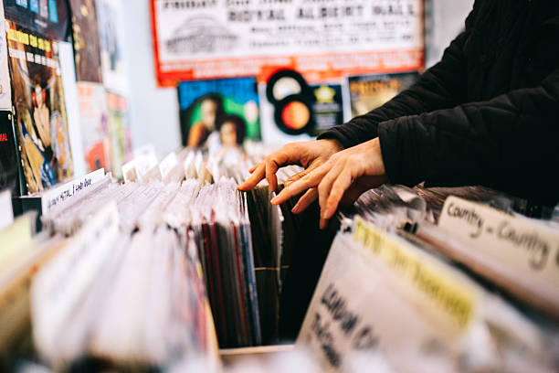 Record store, second hand vinyl records, hands searching stock photo