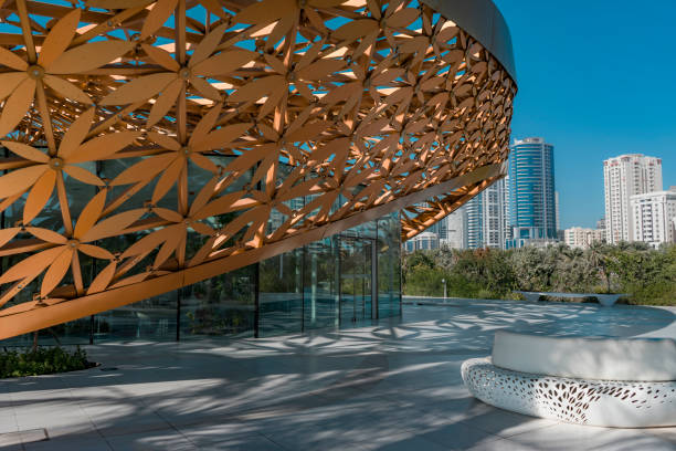 Recreation Area in Front of the Main Entrance to the Charming Exhibition Pavilion of Butterflies, United Arab Emirates Butterfly Island, Sharjah, United Arab Emirates - Feb.2, 2018: Recreation Area in Front of the Main Entrance to the Charming Exhibition Pavilion of Butterflies butterfly garden stock pictures, royalty-free photos & images