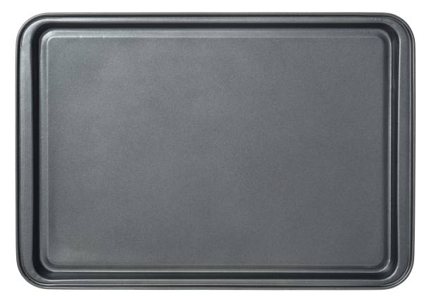 Rectangular black baking tray in oven, isolated on white background. Top view baking tray Rectangular black baking tray in oven, isolated on white background. Top view baking tray baking sheet stock pictures, royalty-free photos & images