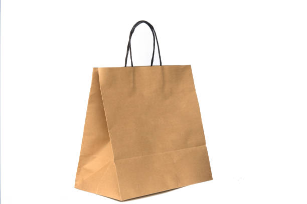 recycled brown paper shopping bags isolated on white background - paper bag craft imagens e fotografias de stock