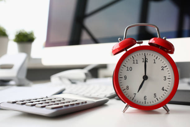 Red alarm clock set at eight in the morning closeup Red alarm clock set at eight in the morning closeup standing on office table. Business or education 7 o'clock management concept arrival departure board stock pictures, royalty-free photos & images