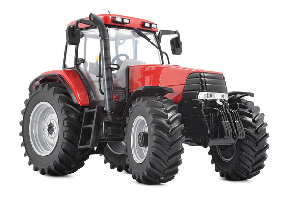 Red and black tractor against white background Tractor studio shot on white background tractor stock pictures, royalty-free photos & images