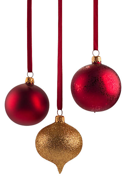 Red and gold Christmas baubles on white background stock photo