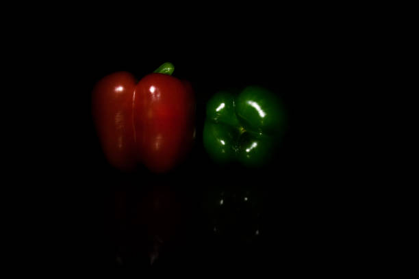 Red and green peppers (law key) stock photo