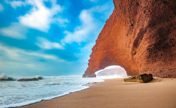 Red arches of Legzira beach, Morocco. stock photo
