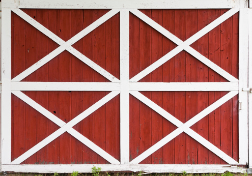 Weathered barn doors with white crossed trim