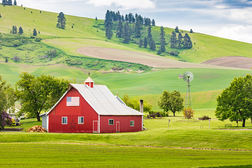 Garfield, Washington, USA. May 24, 2021. A red barn on a picturesque farm in the Palouse hills.