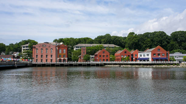 Red brick buildings near Saugatuck river with bridge near downtown in nice summer day stock photo