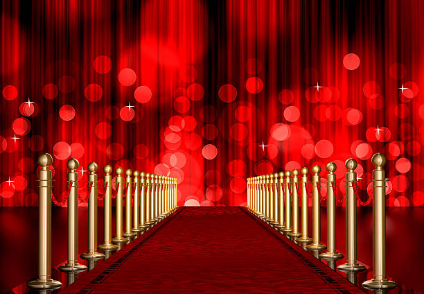 red carpet entrance with Light Burst over curtain stock photo