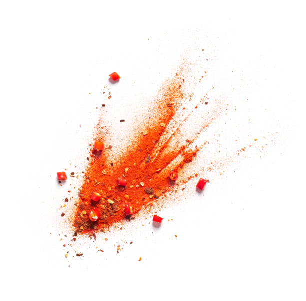 Red chili pepper, powder and flakes burst Red chili pepper, powder and flakes burst spice stock pictures, royalty-free photos & images