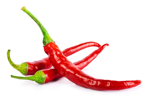 red chili peppers, isoliert auf weiss - chili schote stock-fotos und bilder