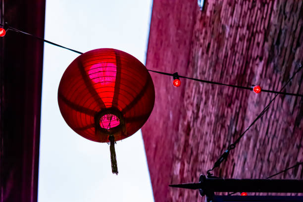 Red Chinese Lantern Hanging in Alleyway stock photo